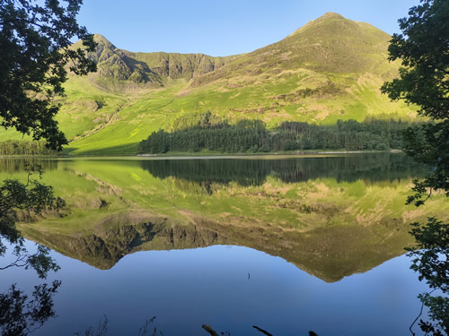 Perfect early morning reflection in Buttermere of the High Stile - High Crag ridge